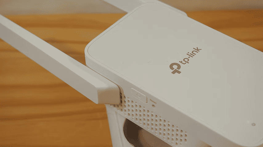 Locate the reset button on the TP-Link extender